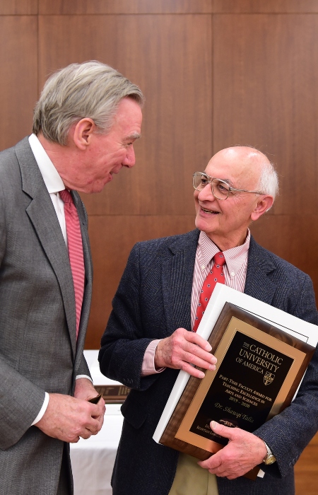 President John Garvey speaking with Dr. Shawqi Talia at the Part-Time Faculty Awards Dinner on march 5, 2020.